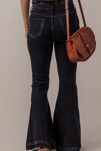 Button-Fly Flare Jeans with Pockets - Jenaklo  Crafted with expert precision, these Button-Fly Flare Jeans with Pockets offer a timeless and classic style. The button-fly design gives a secure fit while the flare leg elongates the silhouette. Complete with functional pockets for convenience, these jeans are a must-have for any wardrobe. Jenaklo #